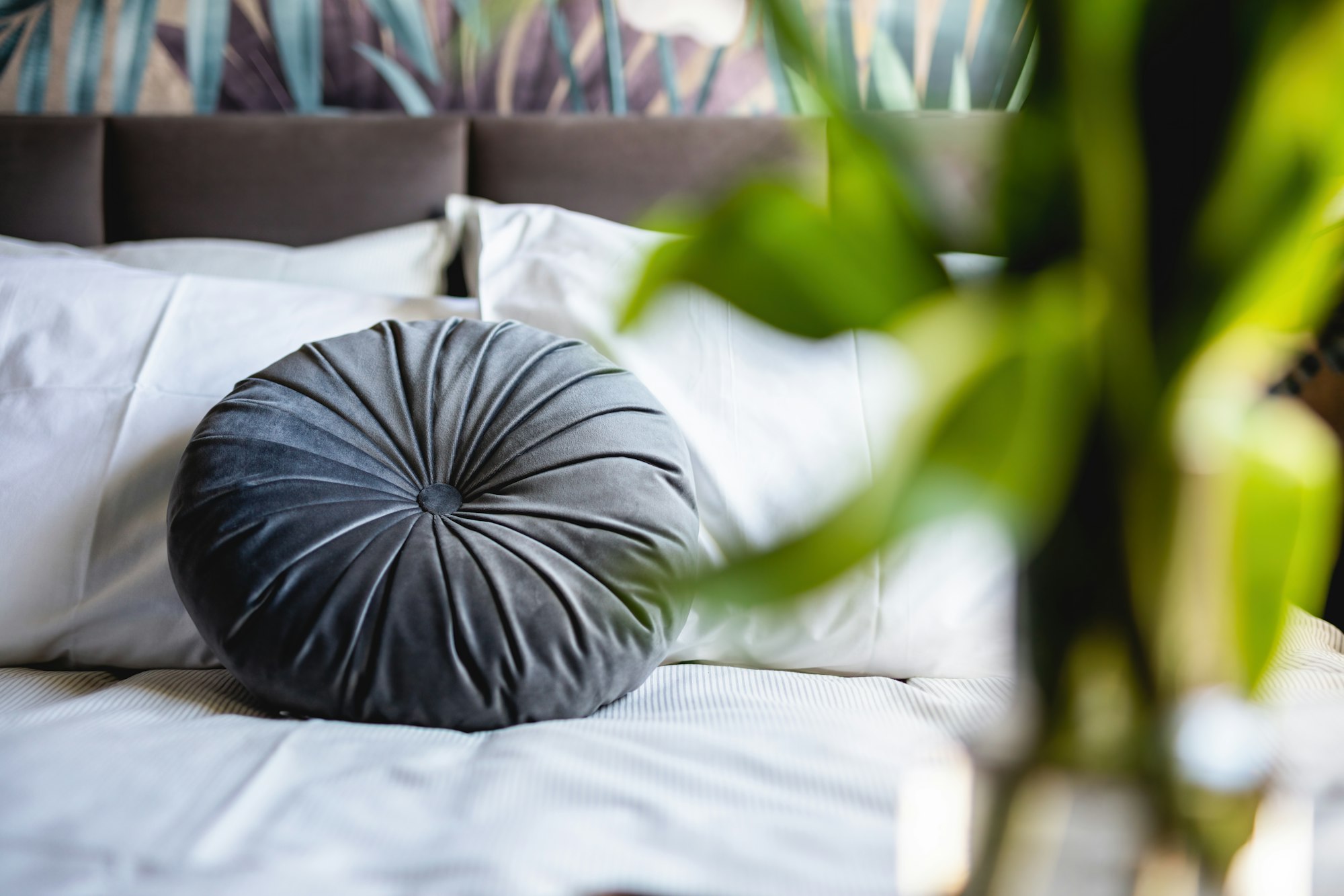 Bedroom home staging with flowers next to bed