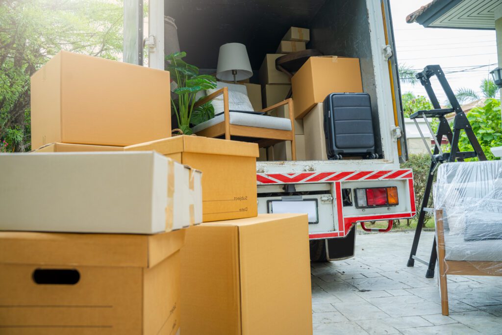 Boxes waiting to be moved into a new home,New home,Moving house day and real estate concept.
